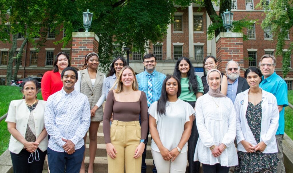 Class of 2023 students pose with alumni, faculty and staff at orientation, Fall 2022