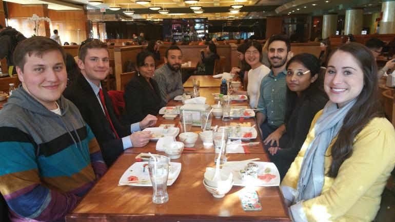 ystem Medicine students eating lunch together after visiting the NIH Sequencing Facility.