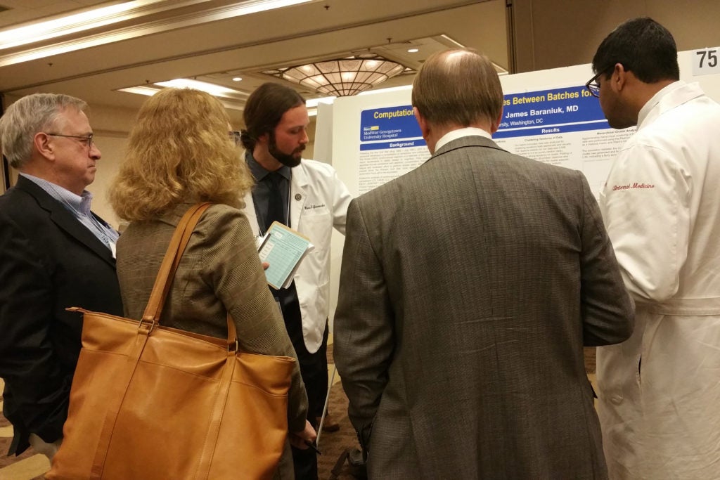 Mario Giovacchini, a System Medicine MD/MS Dual-Degree Program student, presents his research at a poster presentation.